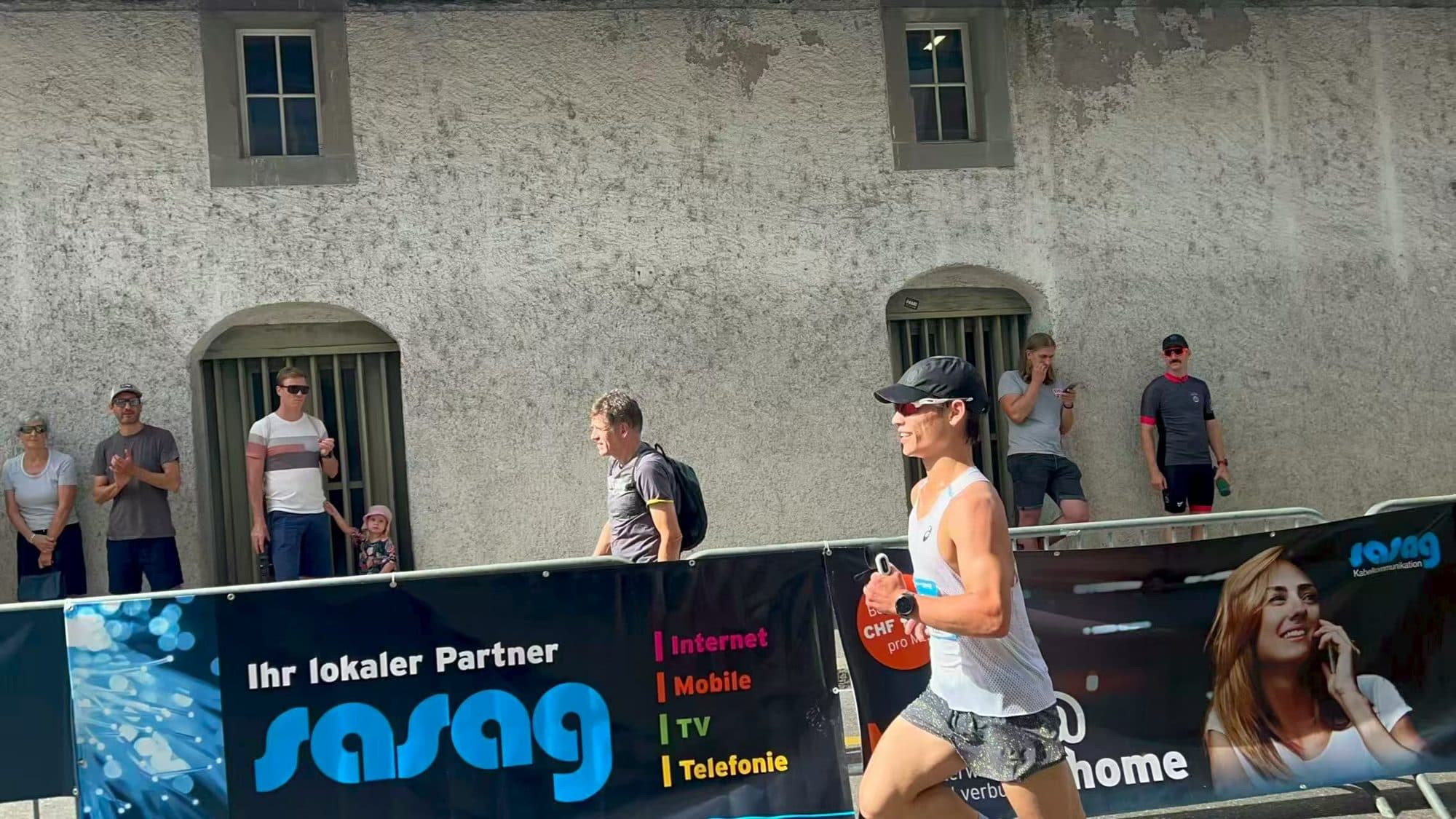 Oscar racing past spectators in Schaffhausen old town